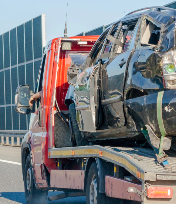 black car being haul